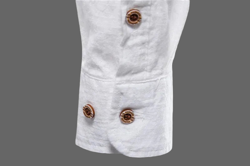 Close-up of a white denim jacket with brown buttons on a white background