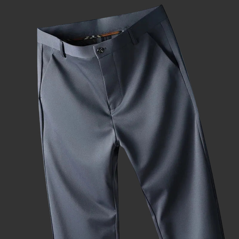 Gray pants displayed against a blue background