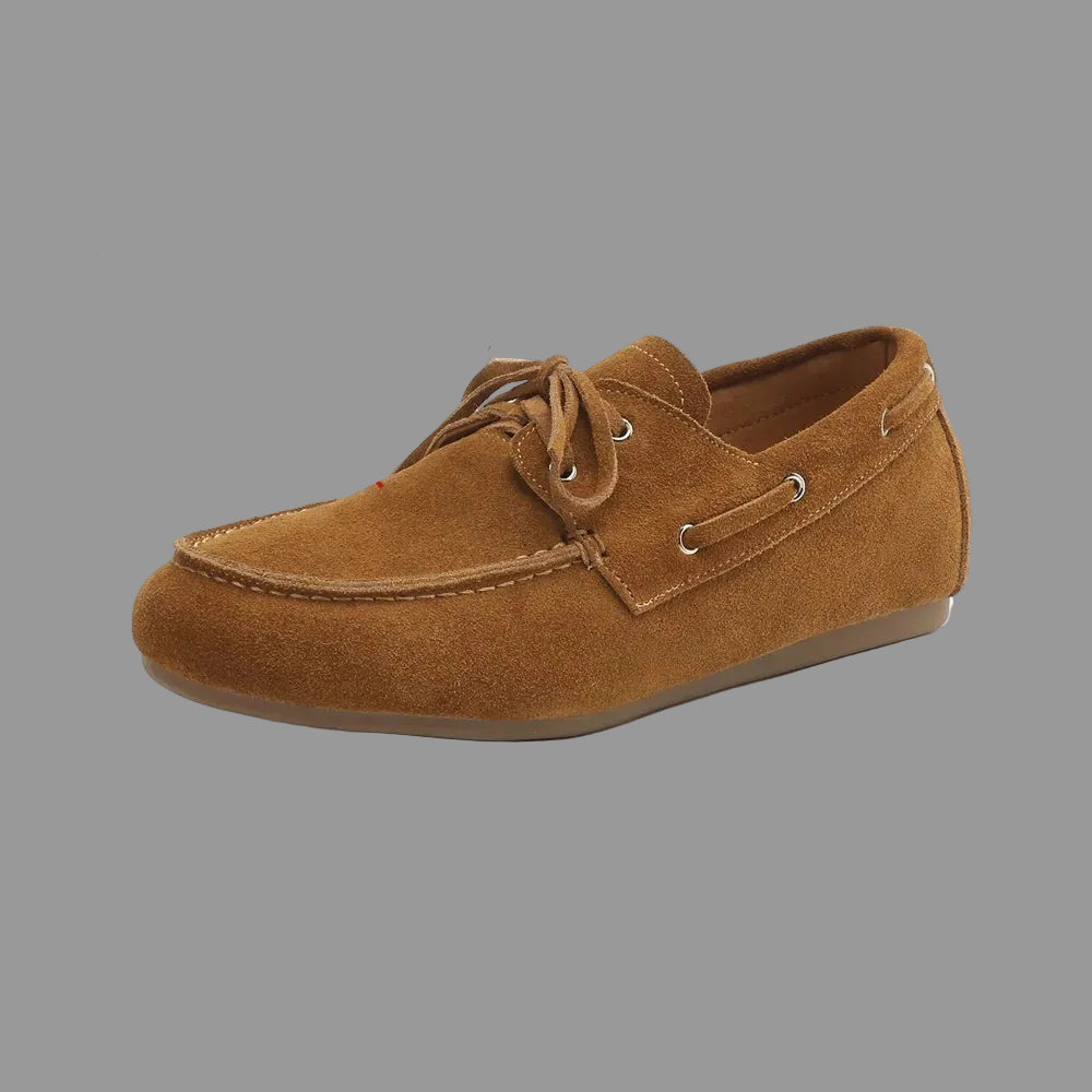 Brown suede loafer shoe with text indicating material and size on a white background