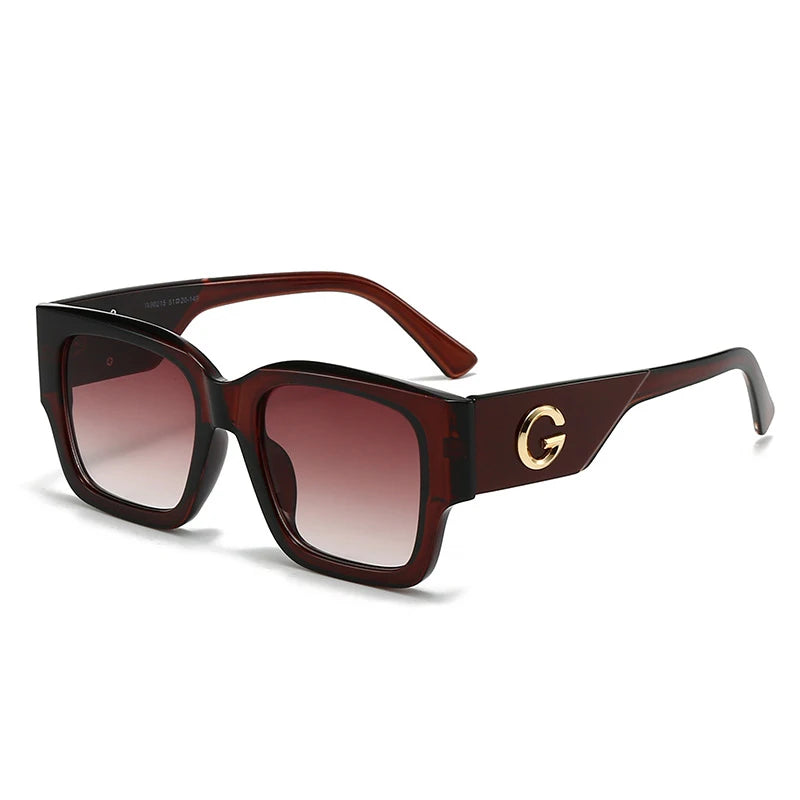 Brown sunglasses with a gold logo on a white background
