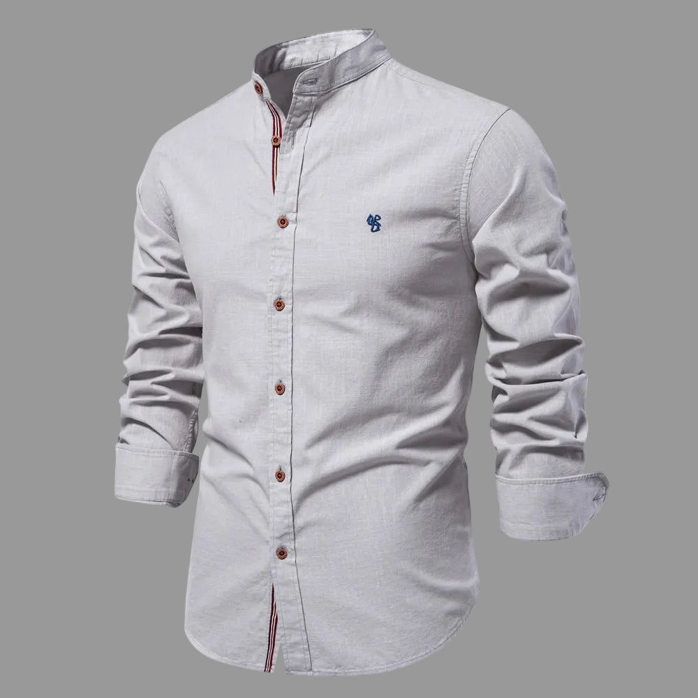 Light gray shirt with button details on a white background