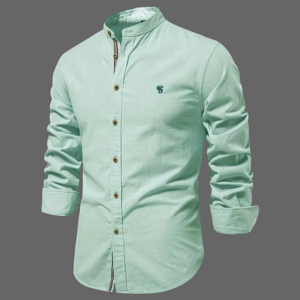 Light green shirt with rolled-up sleeves on a white background