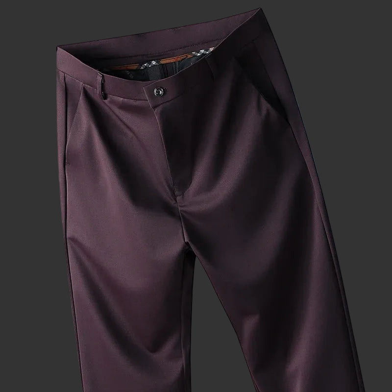 Brown pants displayed against a blue background